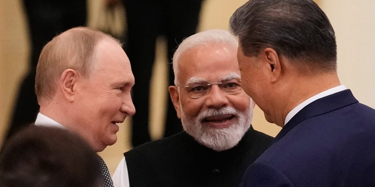 Russian President Vladimir Putin, from left, Indian Prime Minister Narendra Modi and Chinese President Xi Jinping. Photo: AP/PTI