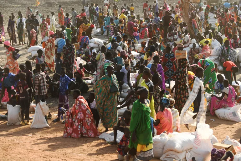 Internally displaced women wait at the food distribution center in Bentiu, South Sudan [File: AFP]